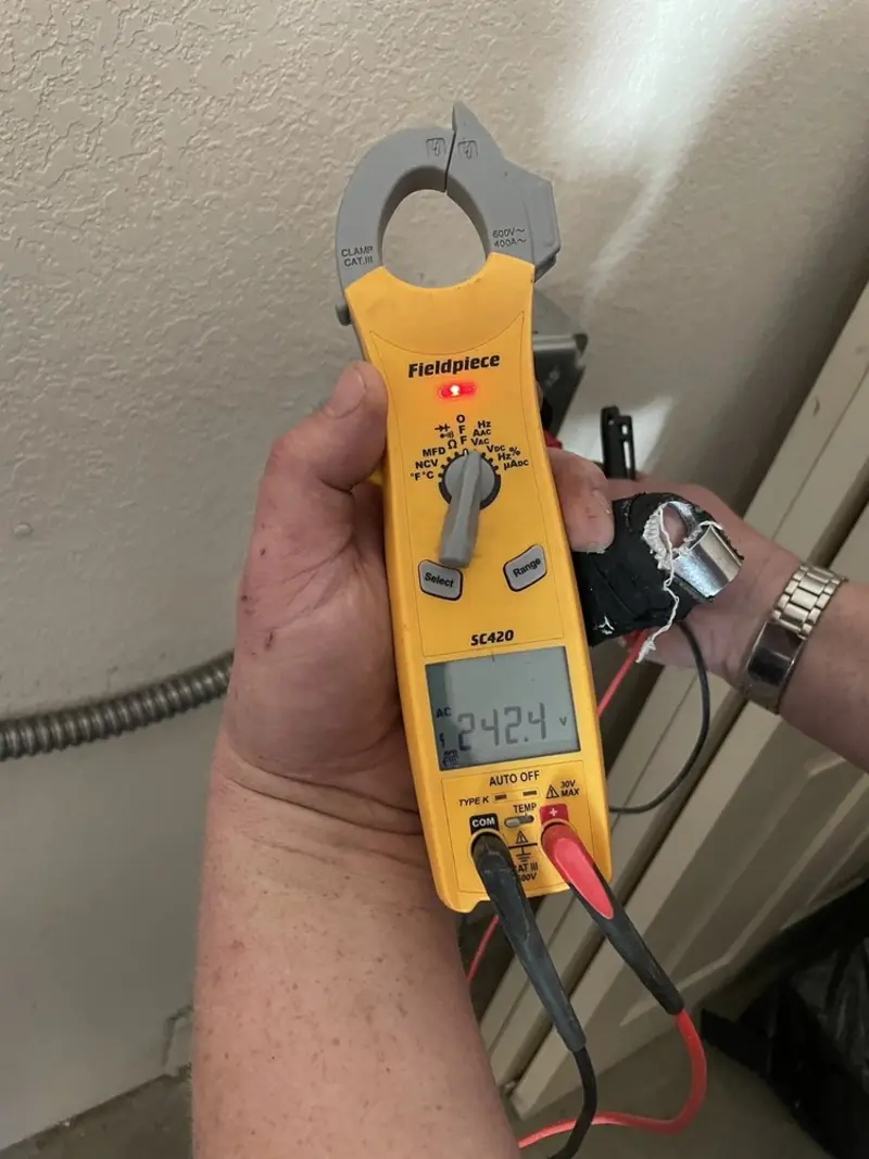 Voltage testing with clamp meter during Generator Installation in Hayes